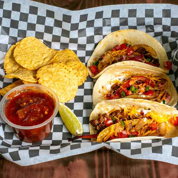 3 hard taco shell with succulent, super moist Mojo pulled pork shoulder, generously coated in house made Maui sauce, topped with shredded cheese and housemade pico de gallo.