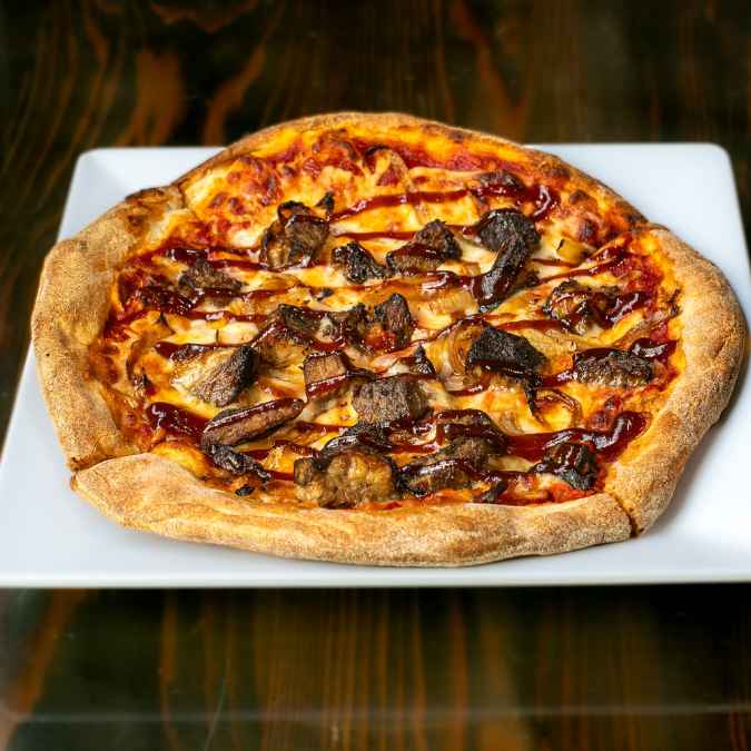 Short Rib Pizza with sauteed onions and BBQ sauce.