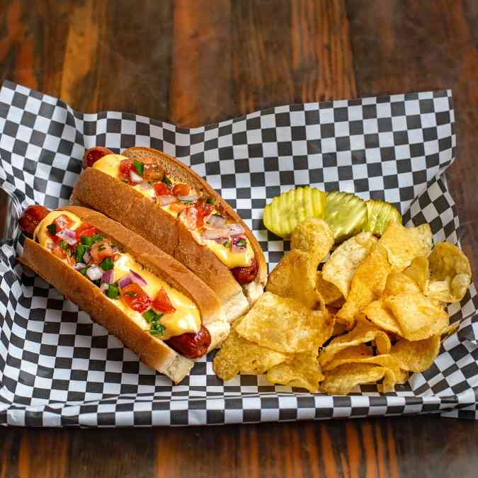 Sabrett 100% beef franks with a natural csasing, smothered with our house chili and beer cheese