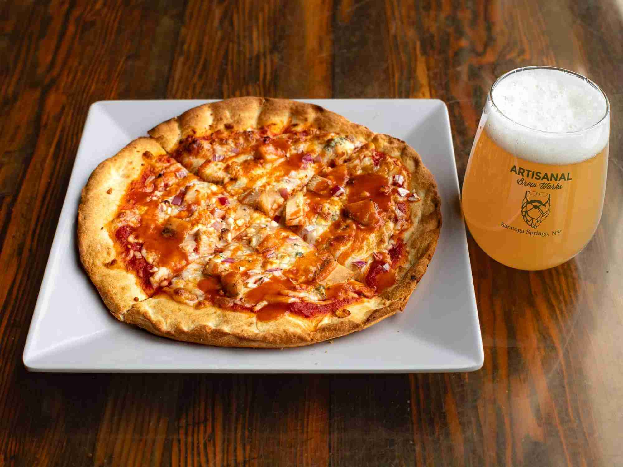 Buffalo chicken pizza with blue cheese, red onions, and buffalo sauce at Nature’s Edge Bistro, a restaurant in Saratoga Springs