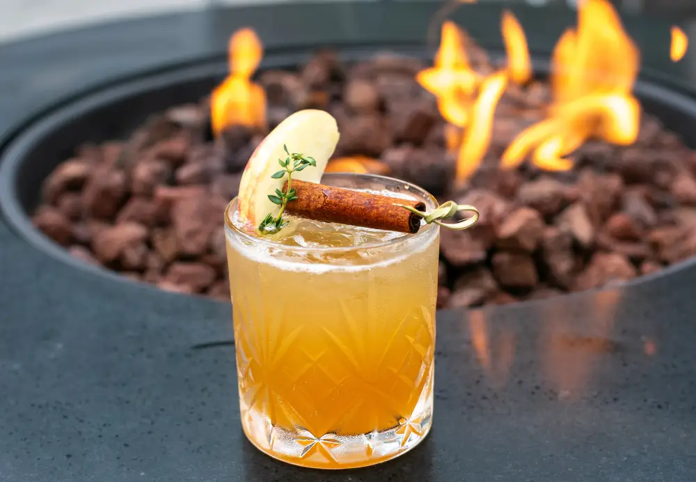 Bourbon cocktail with apple cider, cinnamon, and fresh garnish at Artisanal Brew Works Saratoga Springs