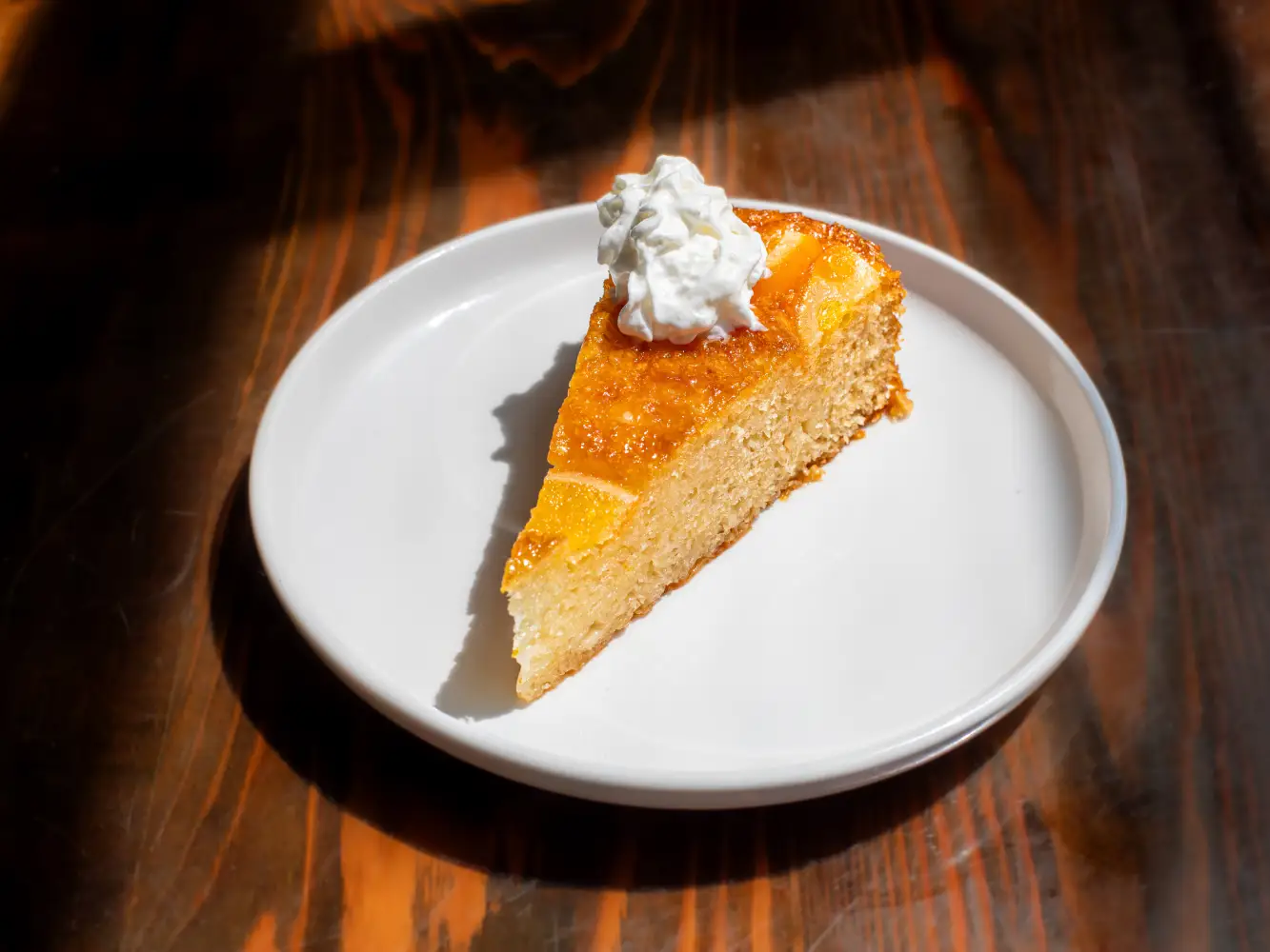 Greek orange cake with citrus syrup and whipped cream at Nature’s Edge Bistro restaurant in Saratoga Springs