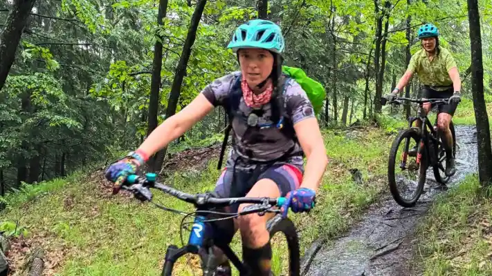 Mountain bikers riding forest trail during the Mighty SMBA Challenge at Artisanal Brew Works in Saratoga Springs