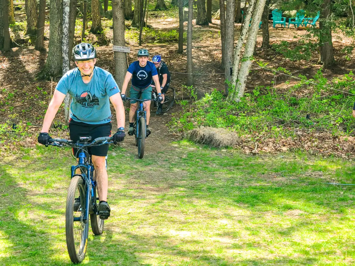 Mountain biking and hiking trails behind Artisanal Brew Works restaurant in Saratoga Springs with riders accessing trails from Nature’s Edge Terrace